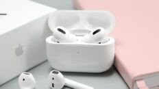AirPods and AirPods Pro beside an open charging case
