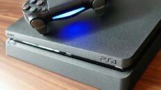 PS4 console with a DualShock controller on top