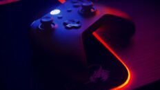 Gaming controller on an RGB mousepad with an illuminated edge
