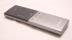 Samsung smart TV remote used to navigate streaming apps and enter an activation code.